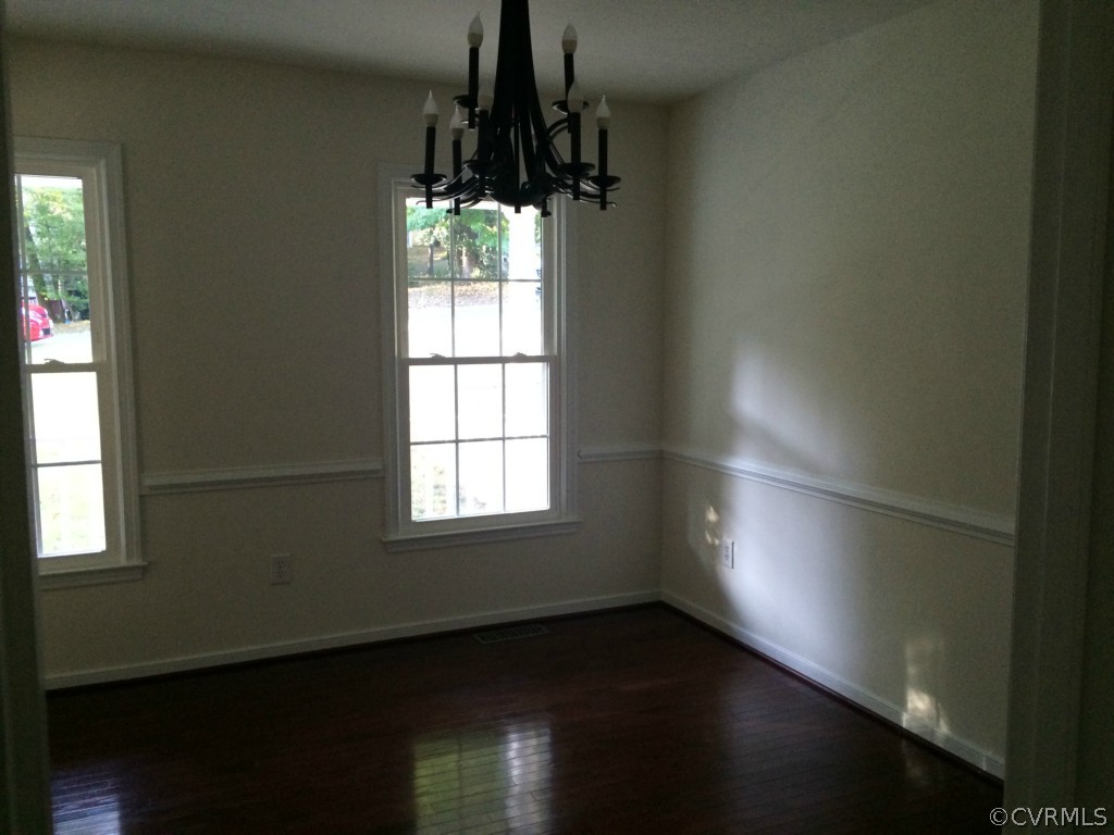 7513 Barkbridge Road Chesterfield, VA 23832 - Photo 5 of 24 an empty room with wooden floor and windows