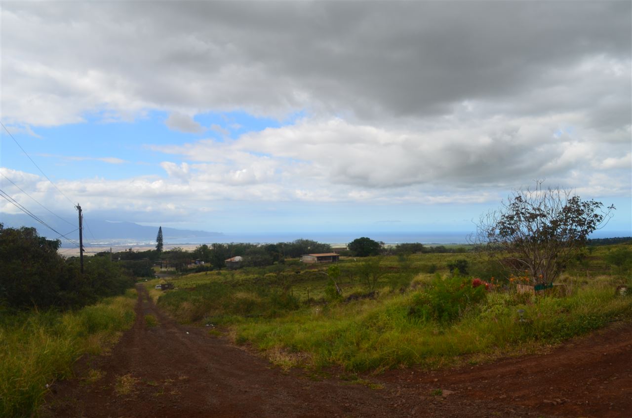 2750 Omaopio Road Kula, HI 96790 - Photo 1 of 3 a view of a town with mountains in the background