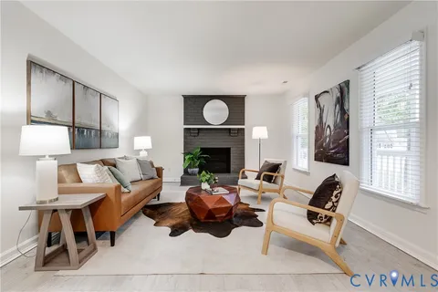 a bed room with furniture and a wooden floor