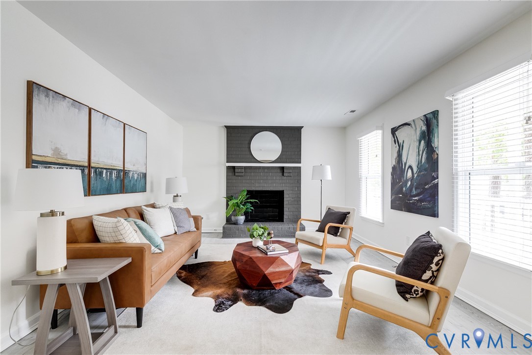 10008 Brittonwood Drive North Chesterfield, VA 23237 - Photo 5 of 34 a living room with furniture and a fireplace