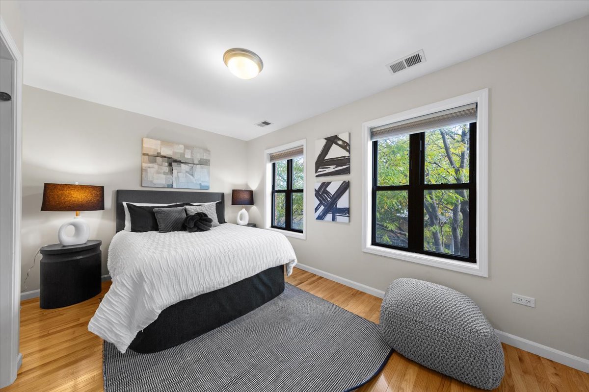 1802 North Spaulding Avenue Chicago, IL 60647 - Photo 13 of 28 a bedroom with a large bed and a window