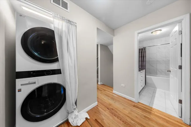 a view of a hallway with washer and dryer