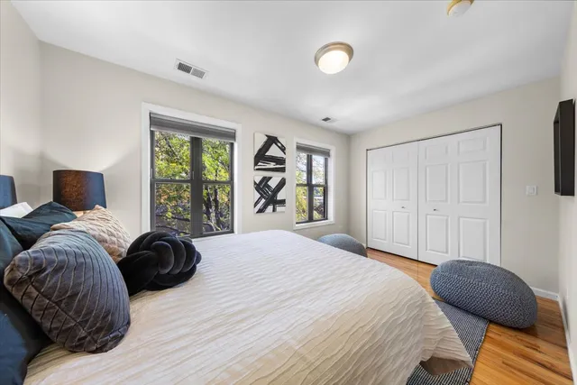 a bedroom with a bed and window