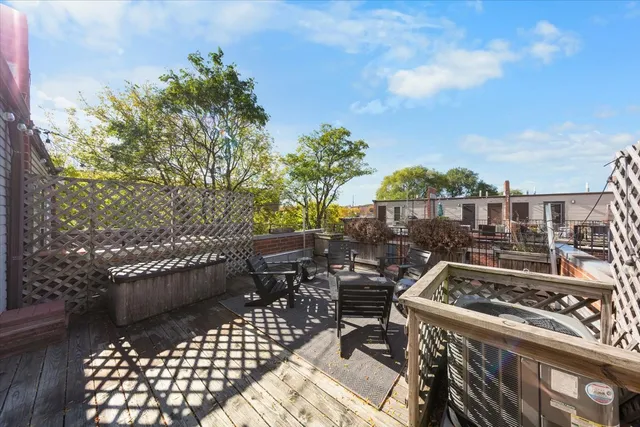 a view of a patio with table and chairs and potted plants