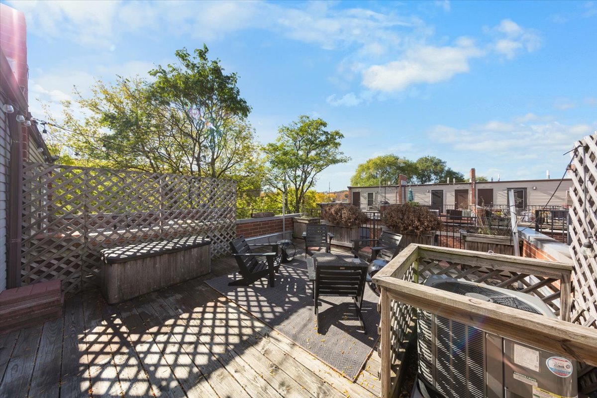 1802 North Spaulding Avenue Chicago, IL 60647 - Photo 26 of 28 a view of a patio with table and chairs and potted plants