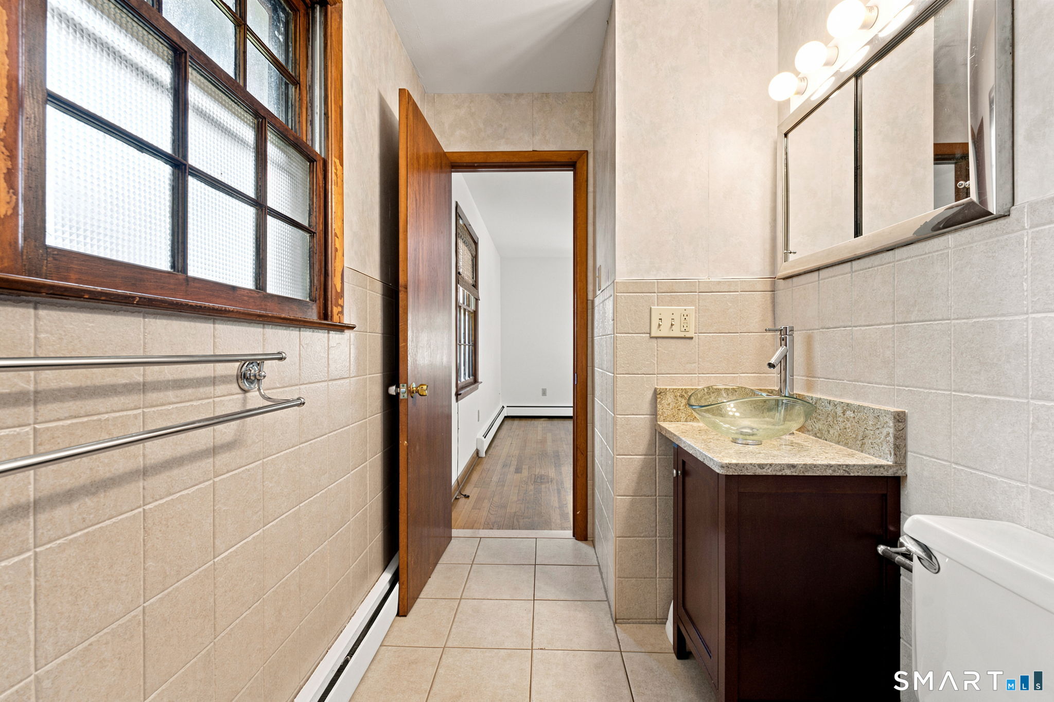 448 Mixville Road Cheshire, CT 06410 - Photo 17 of 32 a bathroom with a sink and a mirror