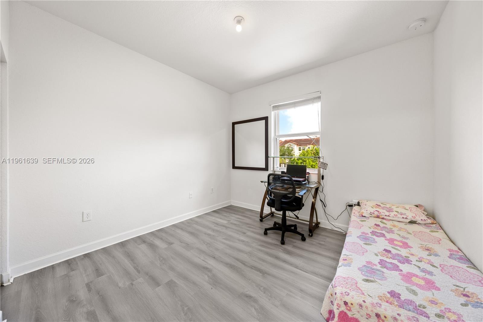 16958 Southwest 92nd Street, Unit 16958 Miami, FL 33196 - Photo 20 of 40 a room with a workspace