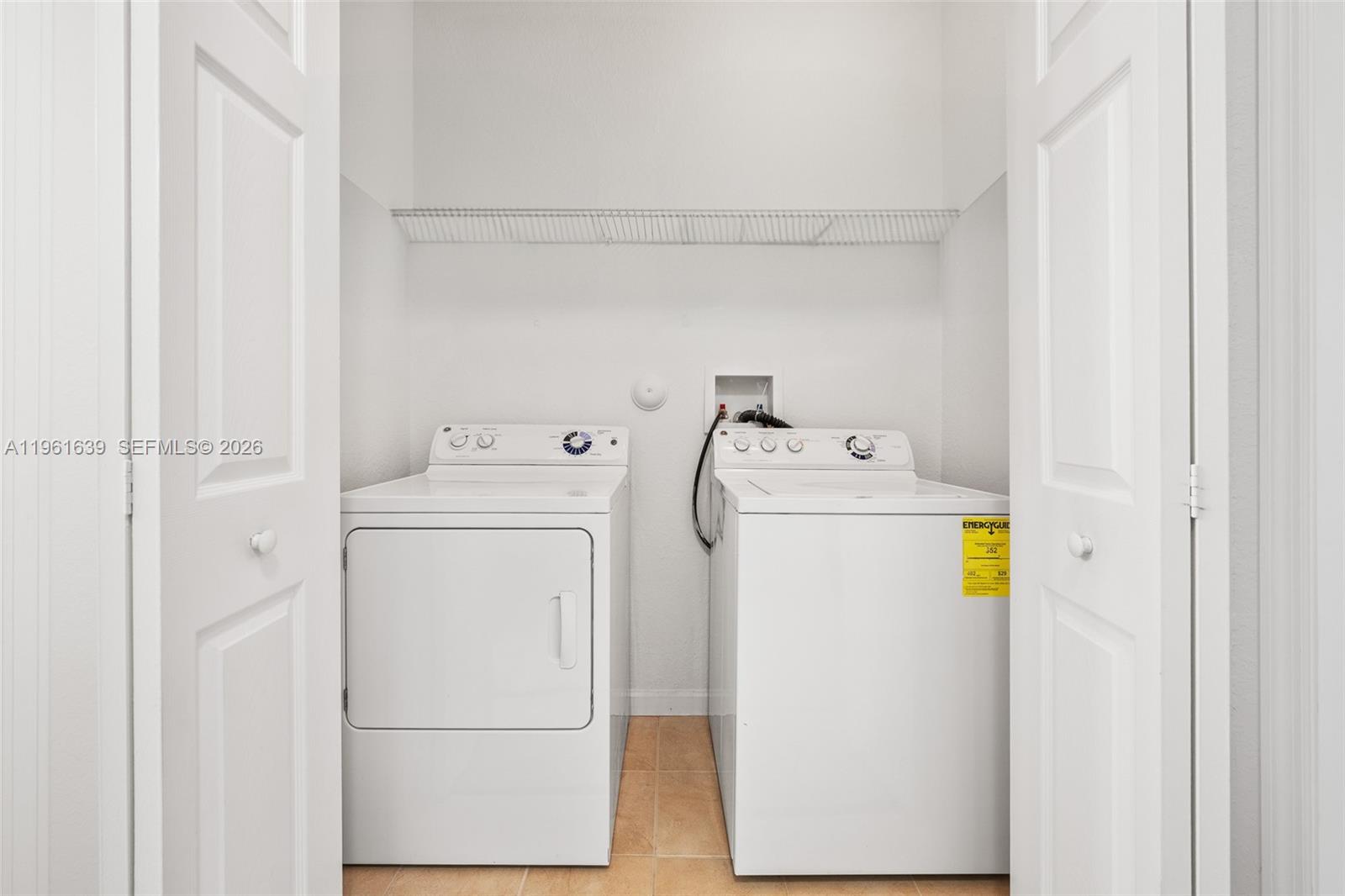 16958 Southwest 92nd Street, Unit 16958 Miami, FL 33196 - Photo 24 of 40 a utility room with dryer and washer