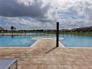 16958 Southwest 92nd Street, Unit 16958 Miami, FL 33196 - Photo 28 of 40 a view of a lake with a large trees