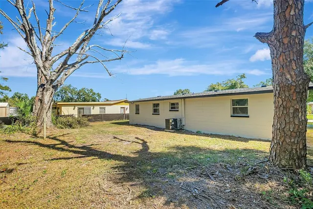 a house view with a backyard space