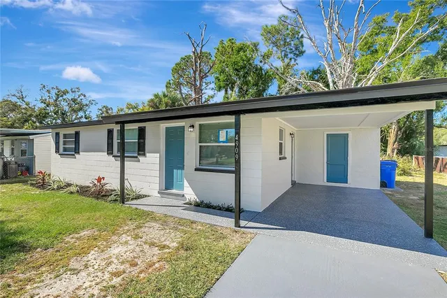 a view of backyard with a garden and plants