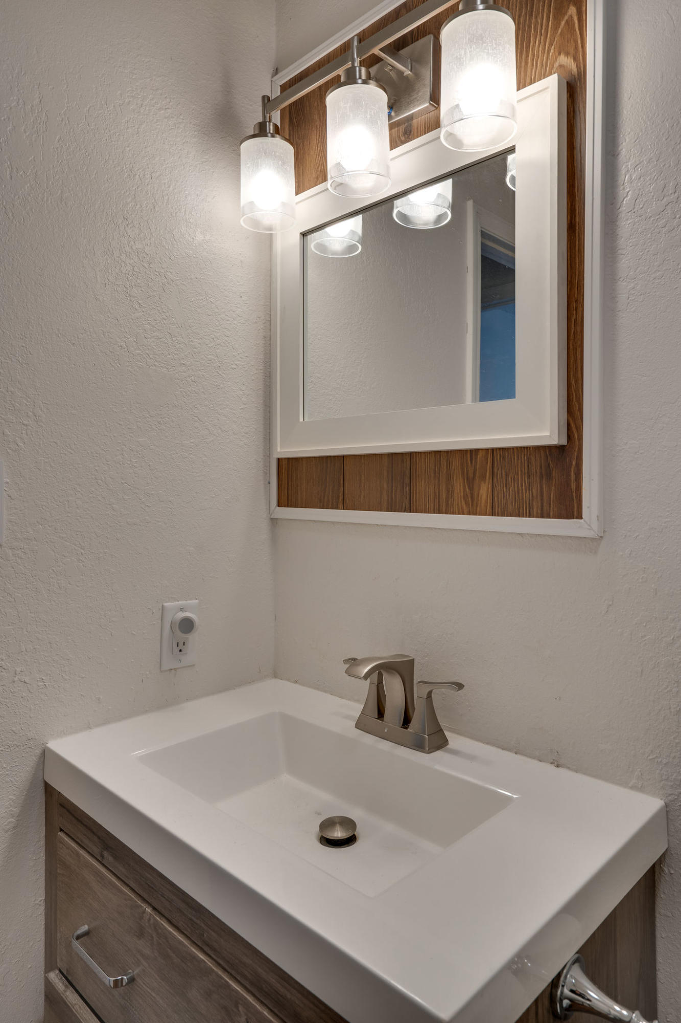 409 Juniper Street Destin, FL 32541 - Photo 21 of 32 a bathroom with a sink and a cabinets