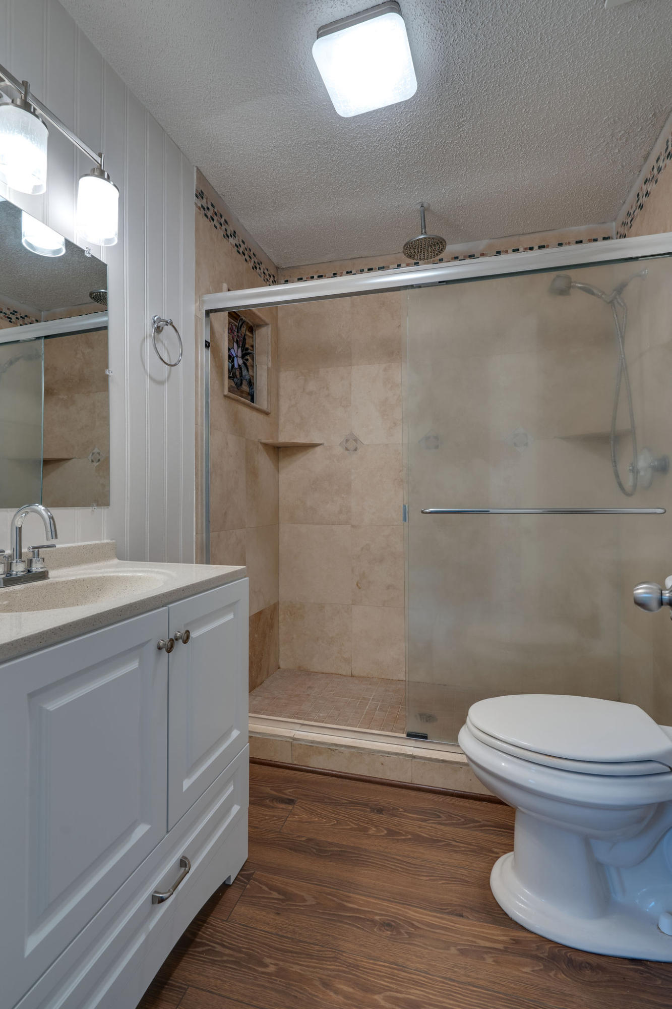 409 Juniper Street Destin, FL 32541 - Photo 25 of 32 a bathroom with a granite countertop sink toilet and shower