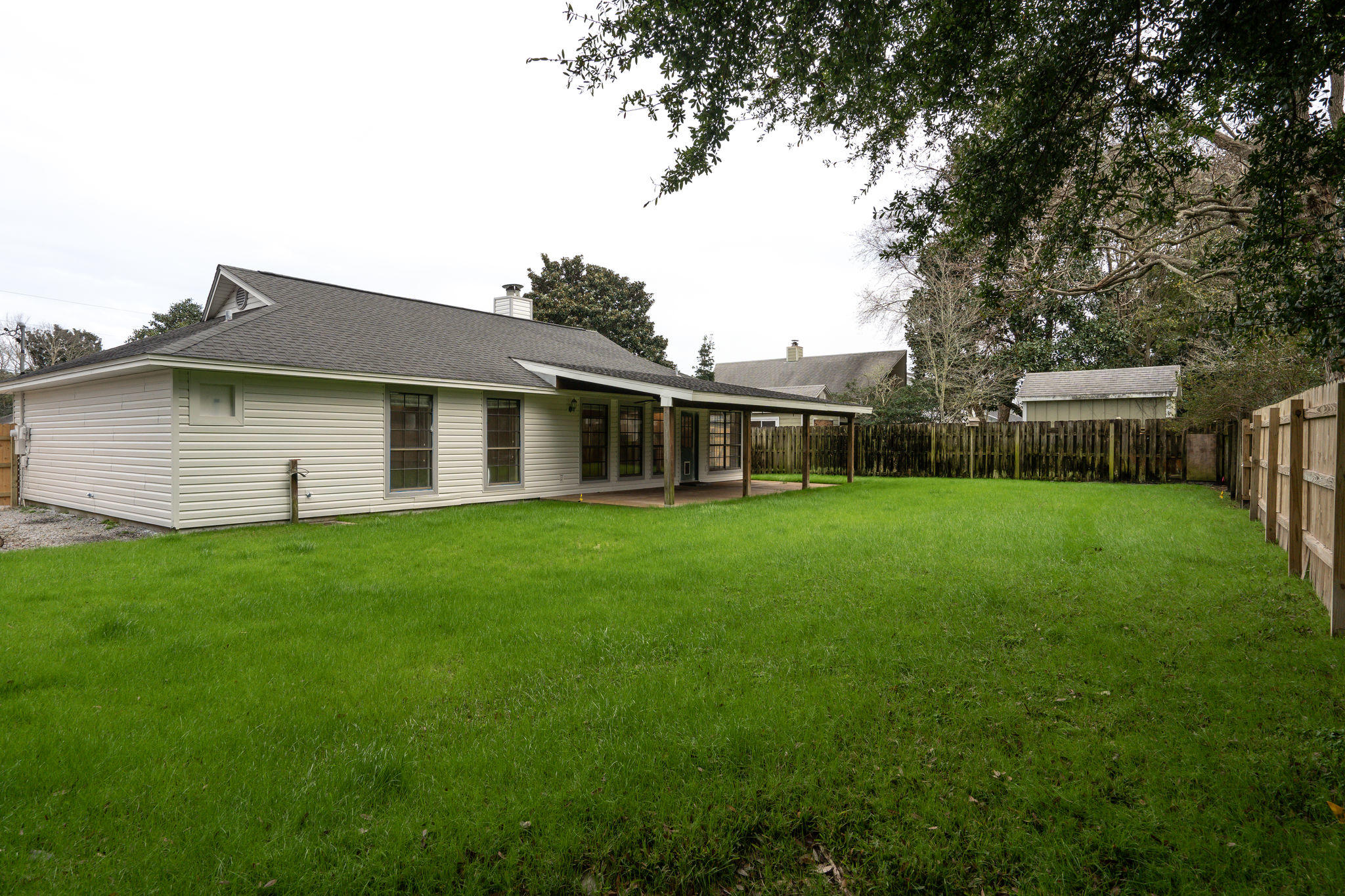 409 Juniper Street Destin, FL 32541 - Photo 29 of 32 a view of a house with backyard and garden