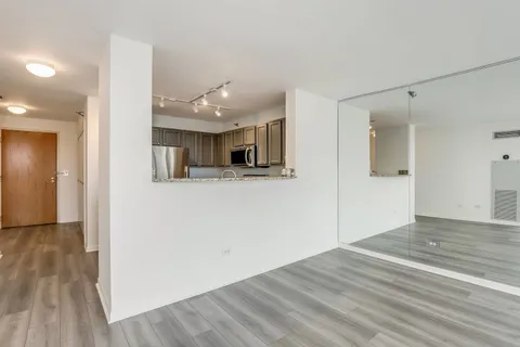 a view of a kitchen from the hallway