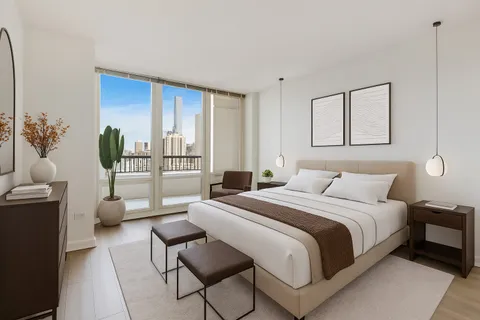 a bedroom with a bed and a couch