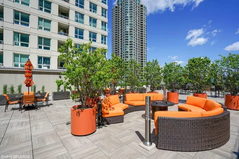 a view of a swimming pool with a lounge chair