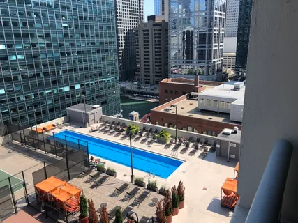 a view of city from balcony with outdoor seating
