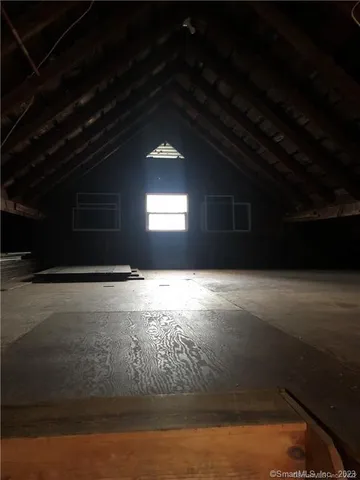 a view of wooden floor and windows in an empty room