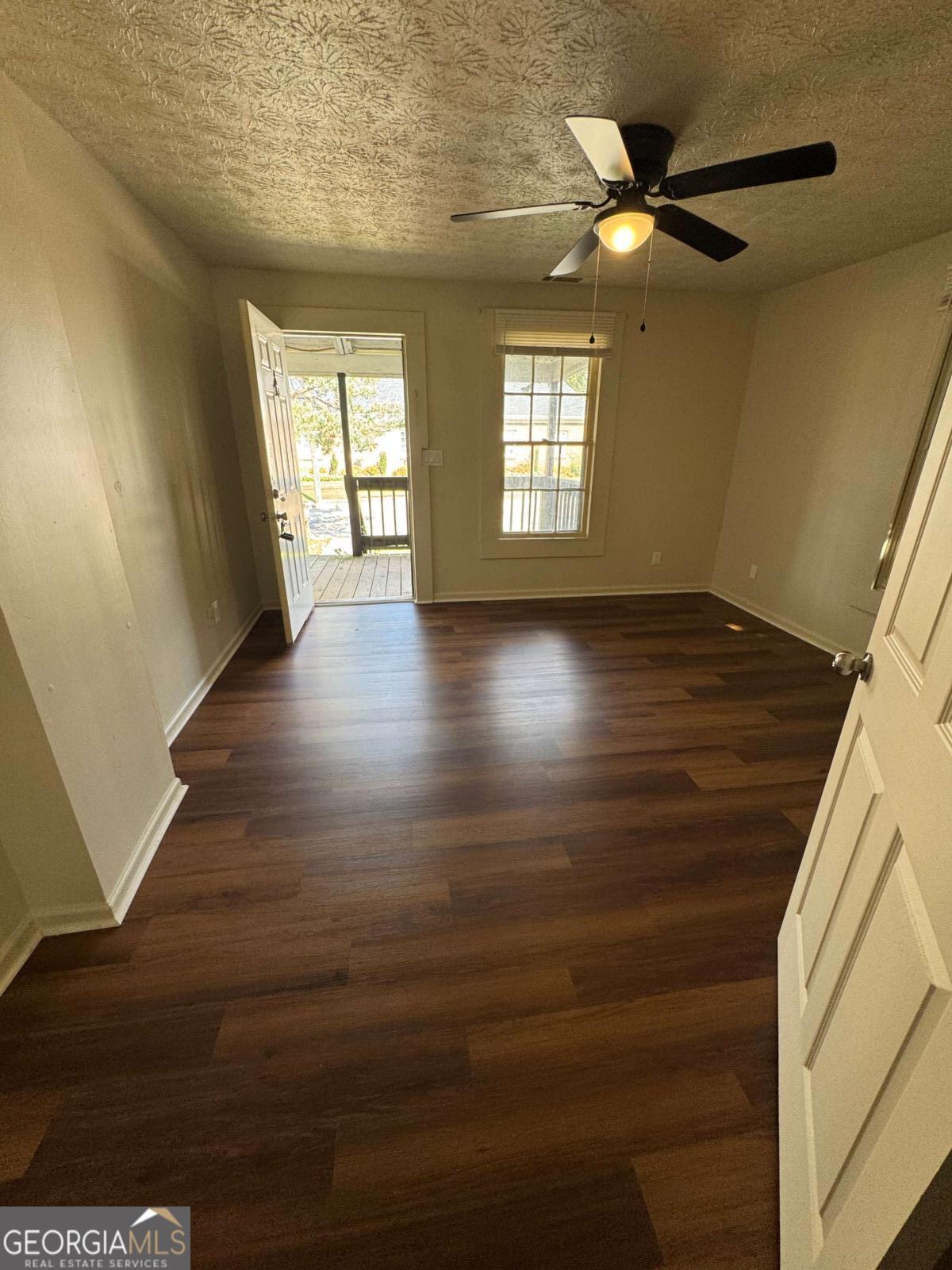 110 Summit Street Southeast Gainesville, GA 30501 - Photo 13 of 18 a view of an empty room with wooden floor and a window