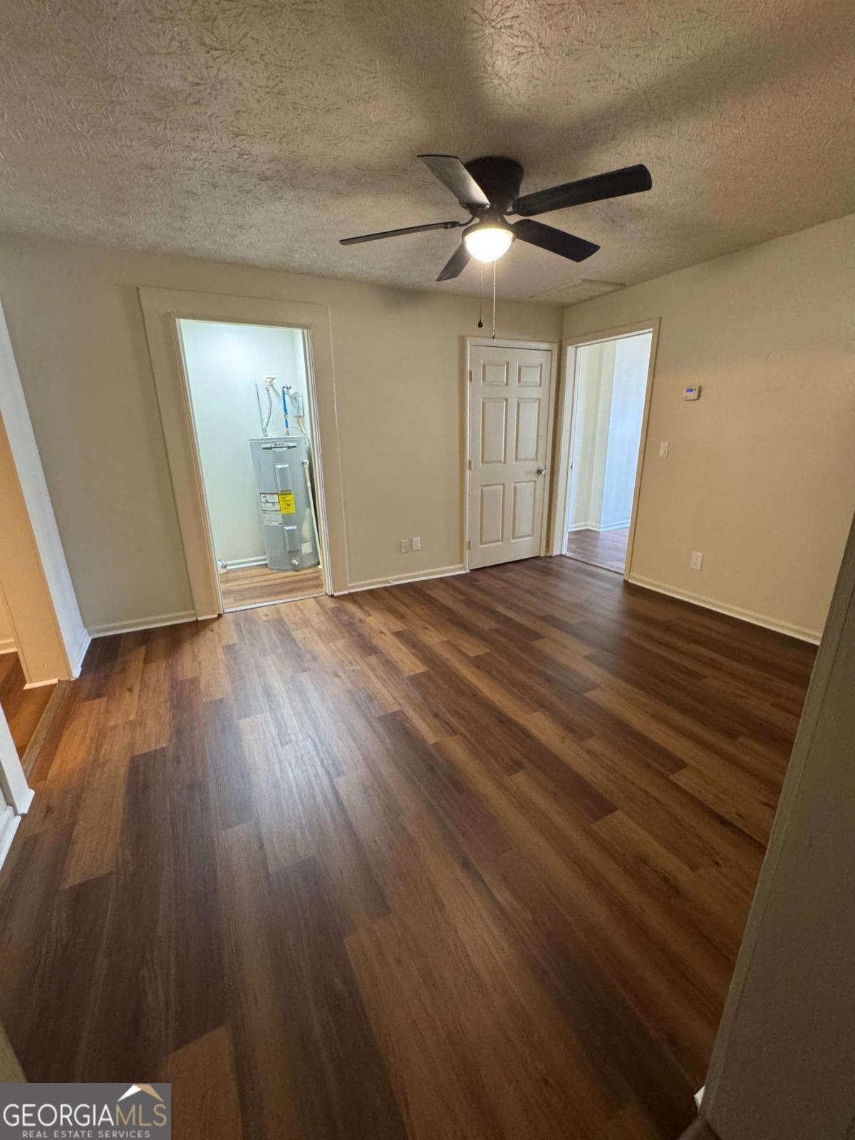 110 Summit Street Southeast Gainesville, GA 30501 - Photo 14 of 18 a view of an empty room with wooden floor and a window