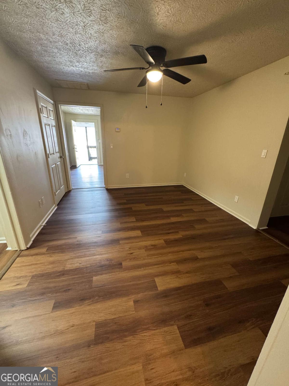 110 Summit Street Southeast Gainesville, GA 30501 - Photo 16 of 18 a view of an empty room and wooden floor