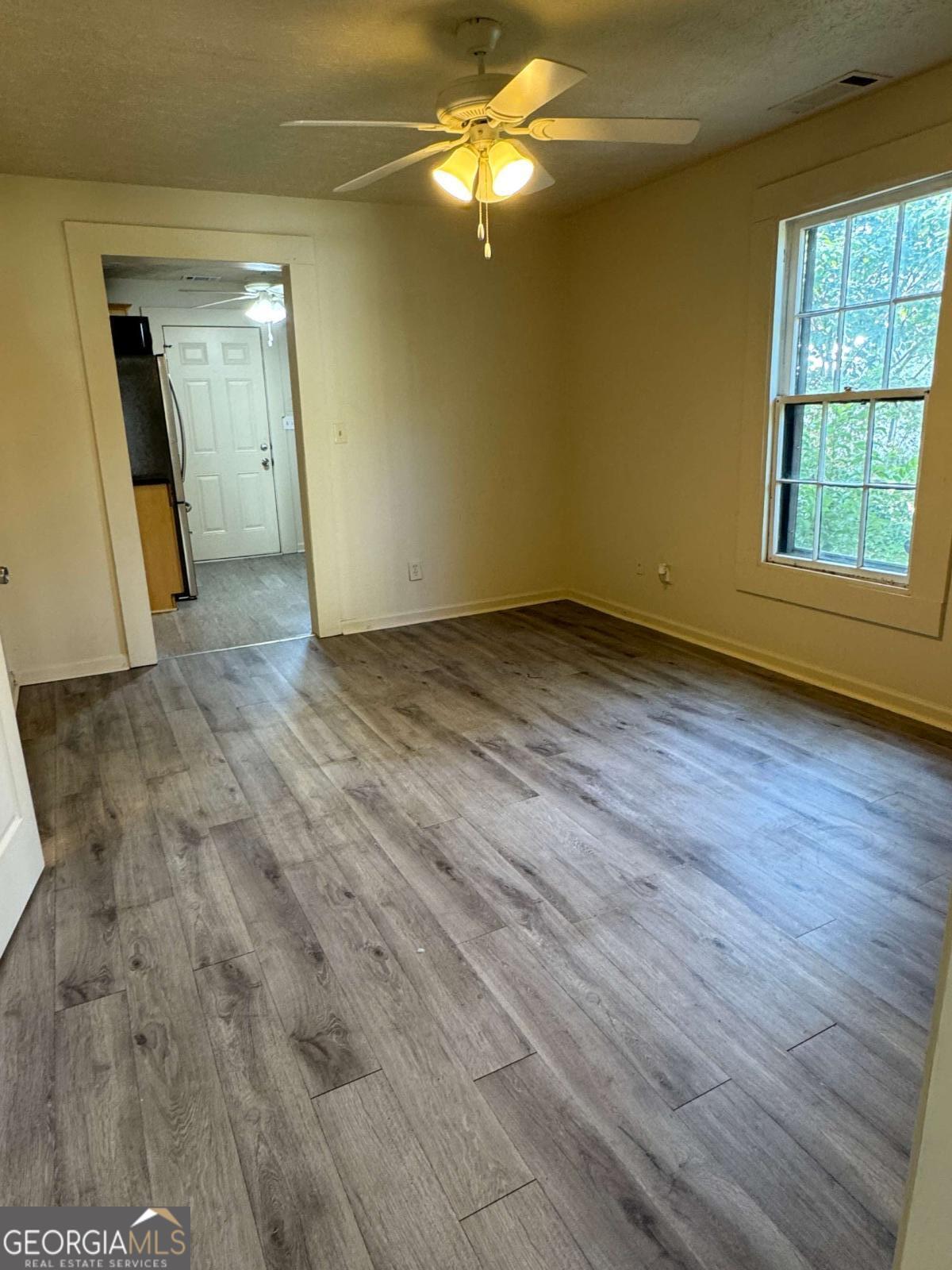 110 Summit Street Southeast Gainesville, GA 30501 - Photo 6 of 18 a view of a livingroom with wooden floor