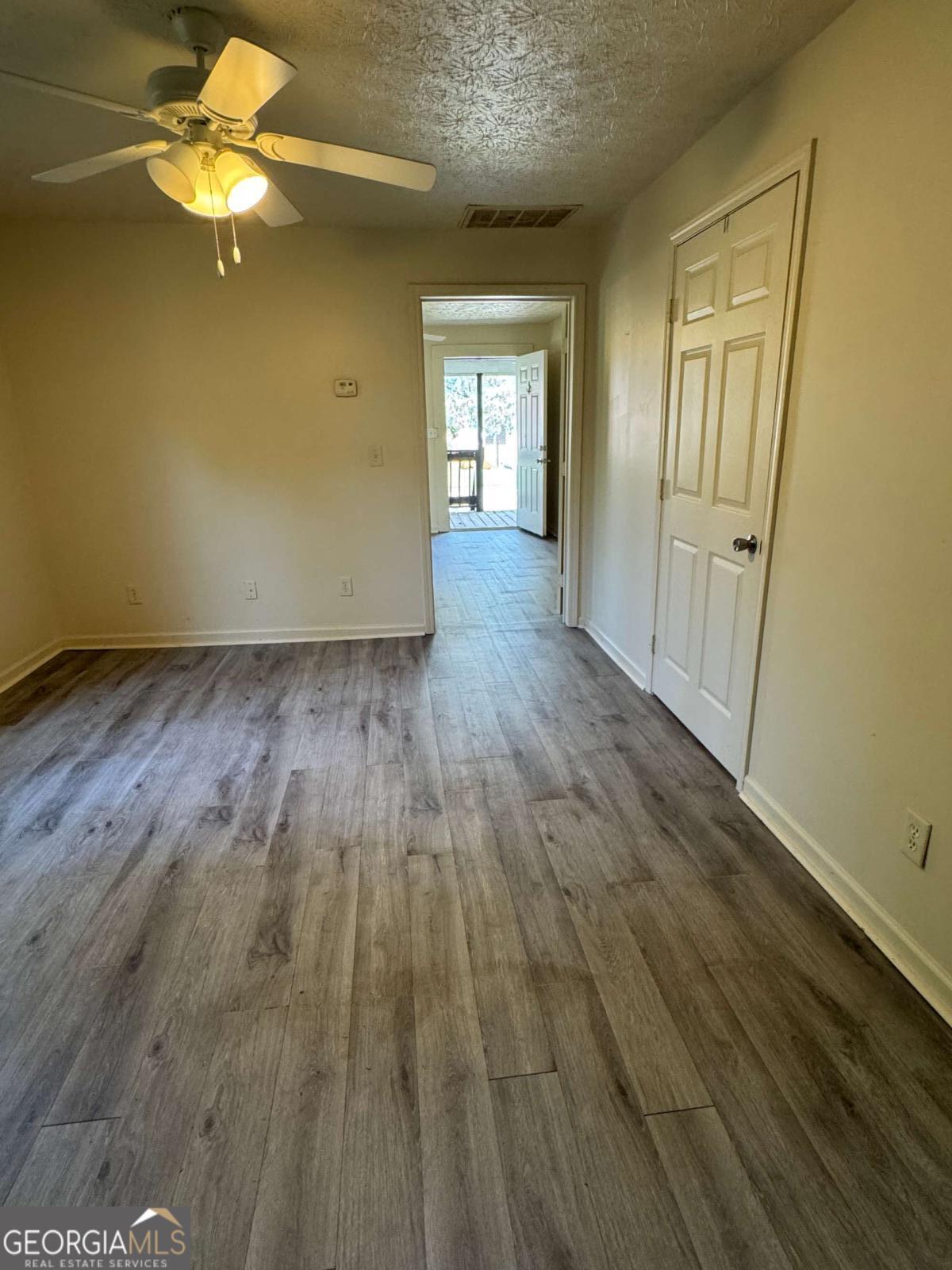 110 Summit Street Southeast Gainesville, GA 30501 - Photo 9 of 18 a view of empty room with wooden floor