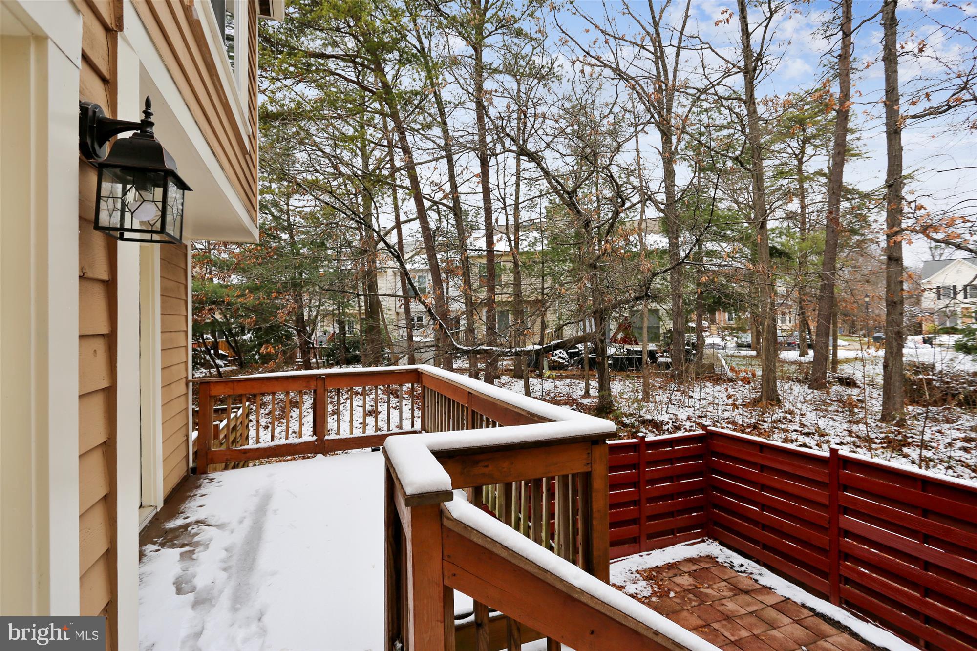 21131 Crocus Terrace Ashburn, VA 20147 - Photo 11 of 37 a view of a roof deck with two couches and wooden floor