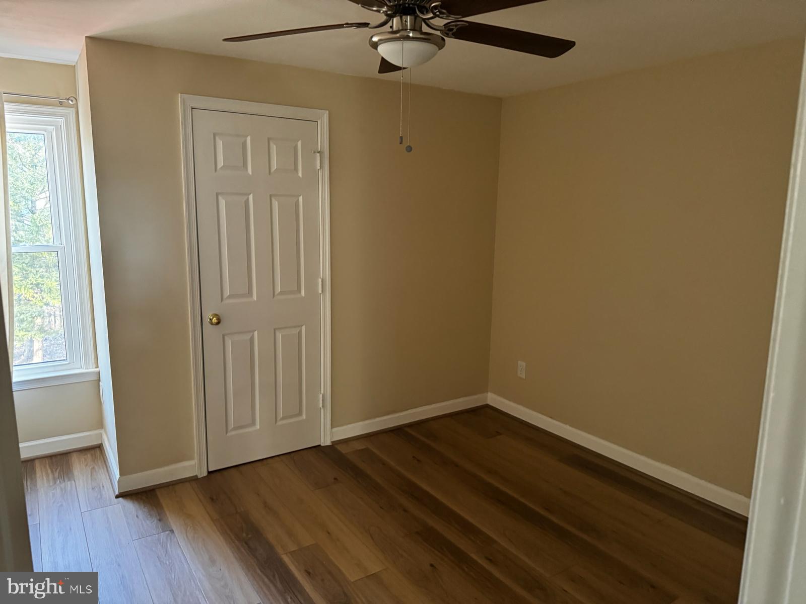 21131 Crocus Terrace Ashburn, VA 20147 - Photo 12 of 37 a view of a room with wooden floor and a window