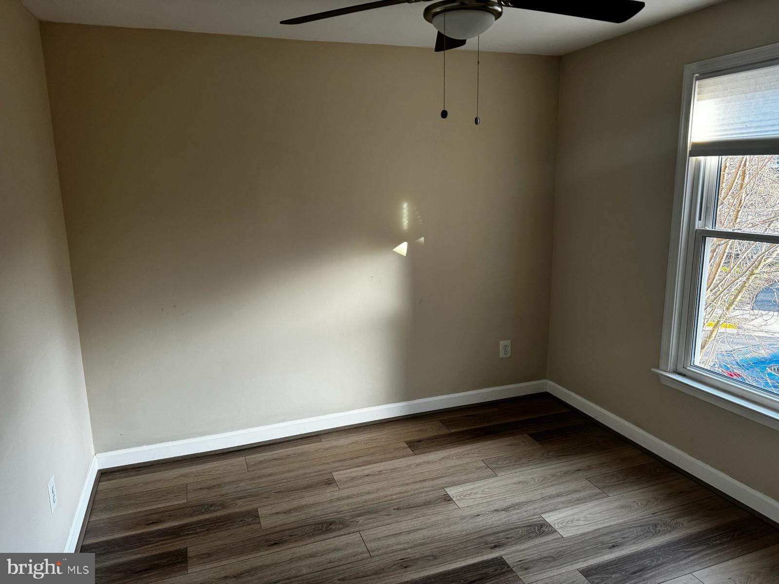 21131 Crocus Terrace Ashburn, VA 20147 - Photo 19 of 37 a view of room with window and wooden floor