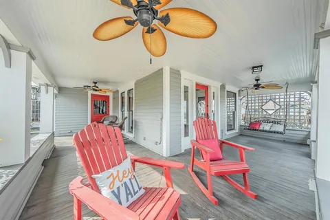 a living room with furniture a rug and gym equipment