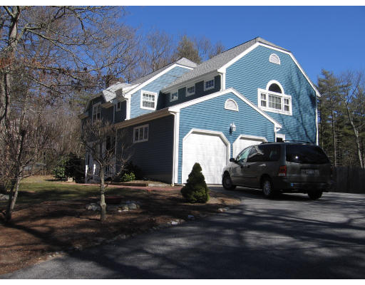22 Bennett Road Rochester, MA 02770 - Photo 2 of 4 a front view of a house with a yard