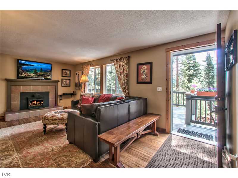 844 Jeffrey Street Incline Village, NV 89451 - Photo 1 of 17 a living room with furniture a flat screen tv and a fireplace