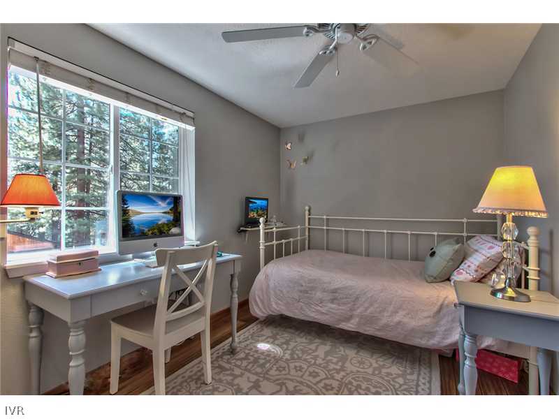 844 Jeffrey Street Incline Village, NV 89451 - Photo 11 of 17 a bedroom with a bed a desk and chair