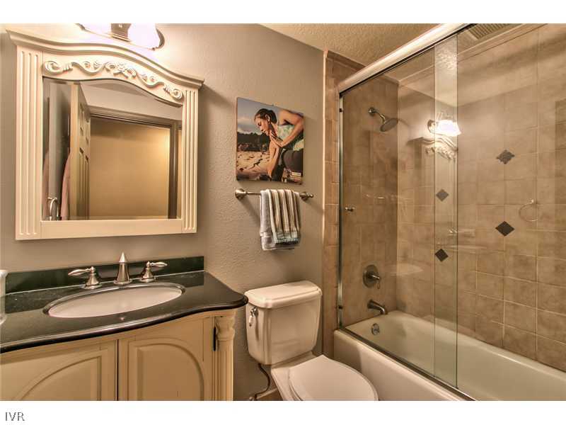 844 Jeffrey Street Incline Village, NV 89451 - Photo 13 of 17 a bathroom with a sink a toilet a mirror and shower