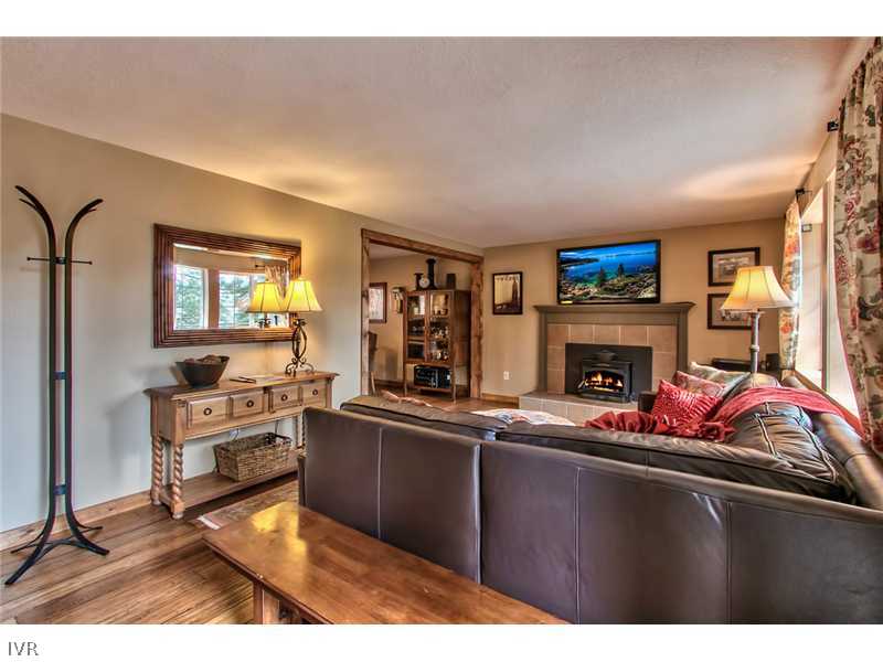 844 Jeffrey Street Incline Village, NV 89451 - Photo 5 of 17 a living room with furniture a fireplace and a flat screen tv