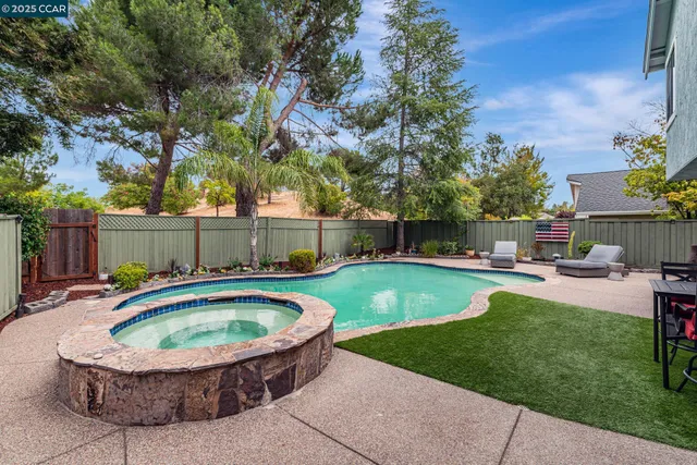 a view of swimming pool with seating space