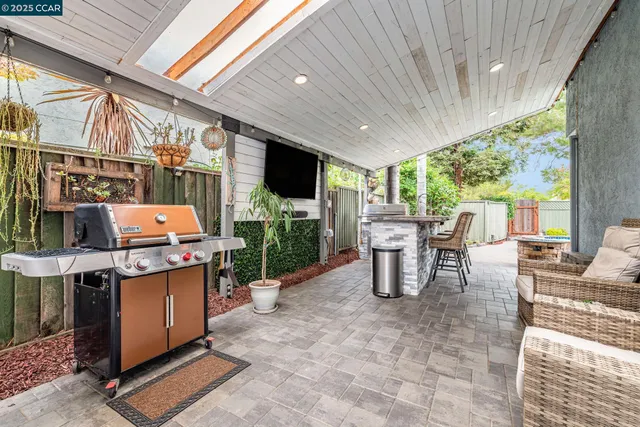 a garden view with a seating space and swimming pool