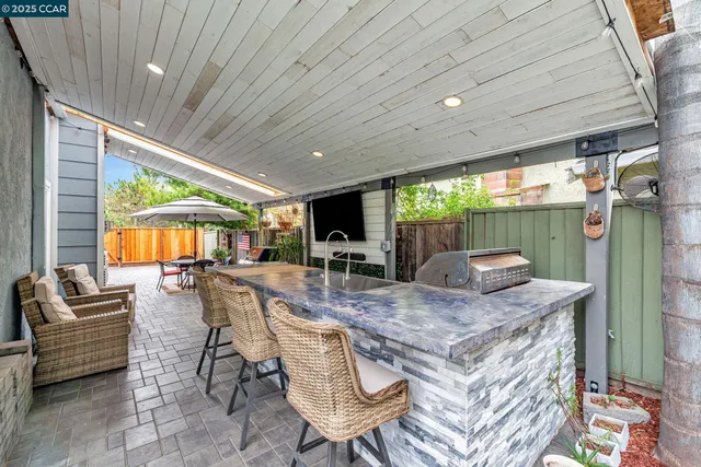 a dining room with furniture and a floor to ceiling window