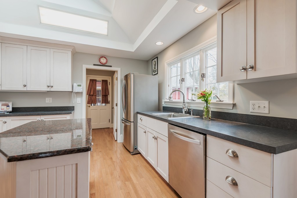 130 Hidden Road Andover, MA 01810 - Photo 10 of 27 a kitchen with granite countertop a sink stainless steel appliances and cabinets