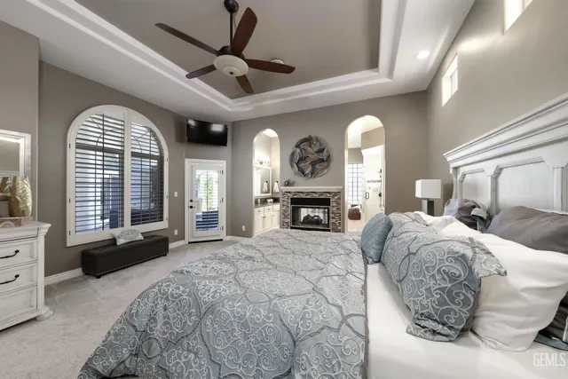 a large kitchen with stainless steel appliances a stove a sink and a fireplace