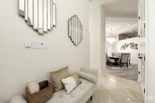 a large bed sitting in a bedroom next to a window