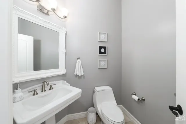 a bathroom with a double vanity sink mirror and shower