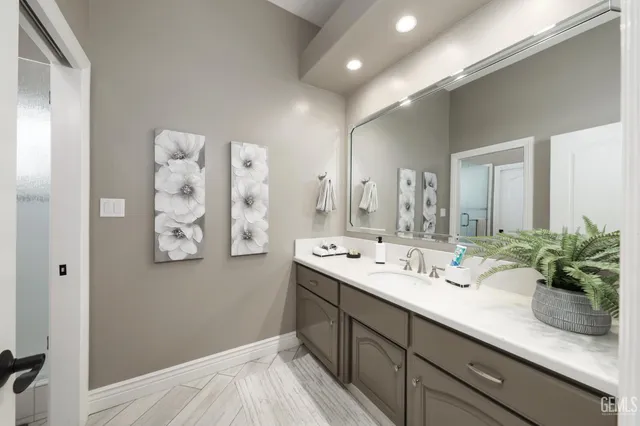a view of spacious bathroom with a sink