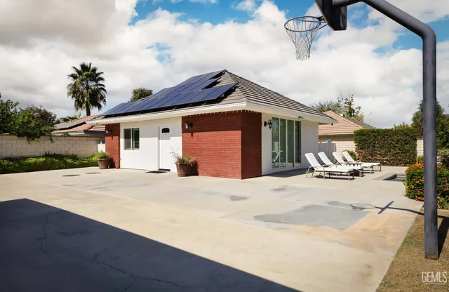 a bedroom with a bed and a chair