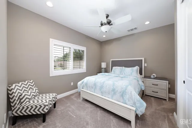 a kitchen with stainless steel appliances granite countertop a stove a refrigerator and a microwave