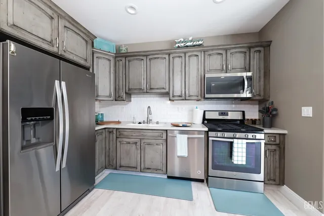 a swimming pool with outdoor seating and plants