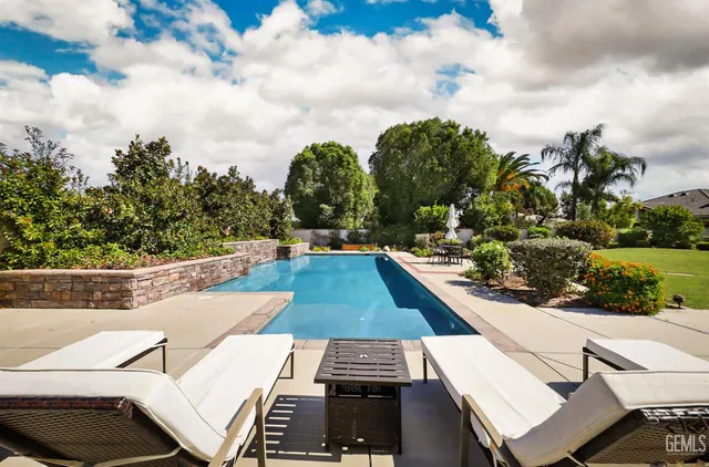 a view of swimming pool from a balcony