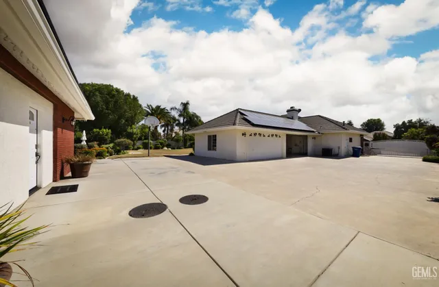 a view of wooden door in front of house